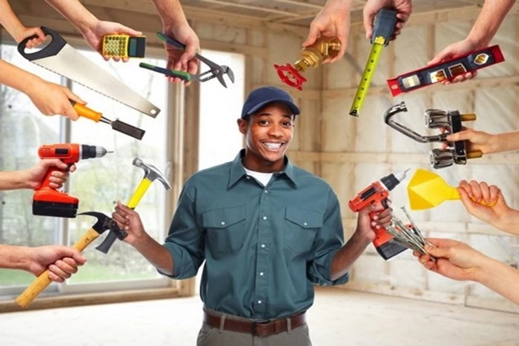Picture of a male Handyman Contractor showing off his tool collection