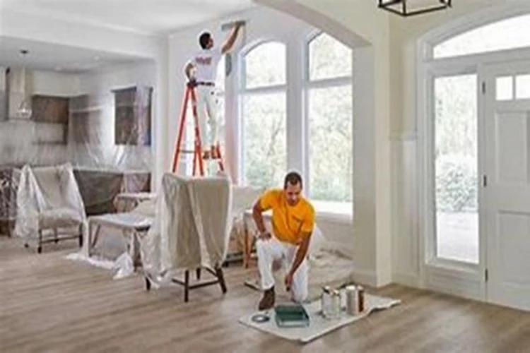 Picture of two Painting Contractors preparing to paint the inside of a home